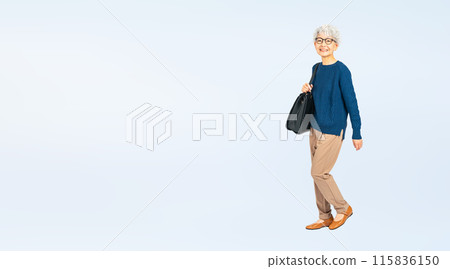 Full body photo of a senior woman walking with a bag 115836150