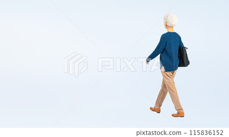 Full-body photo of a senior woman walking with a bag 115836152