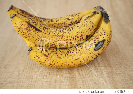 rotten banana on a wooden table rotten banana on a wooden table 115836264