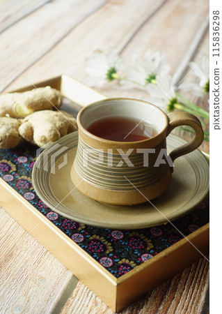 Ginger tea on wooden background. Ginger tea on wooden background. 115836298