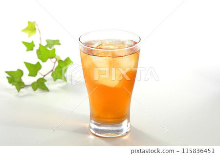 Iced tea poured into a glass 115836451
