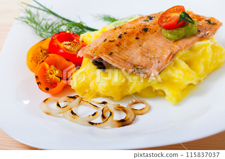 Roasted trout fillet with potato puree, vegetables 115837037