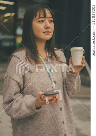 A scene of a 20-something office lady going out during her lunch break 115837202