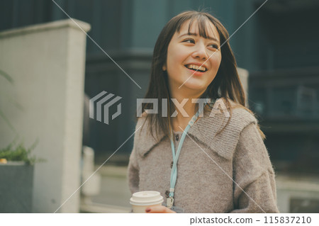 A scene of a 20-something office lady going out during her lunch break 115837210