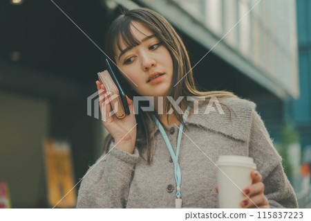 A scene of a 20-something office lady going out during her lunch break A scene of a 20-something office lady going out during her lunch break 115837223