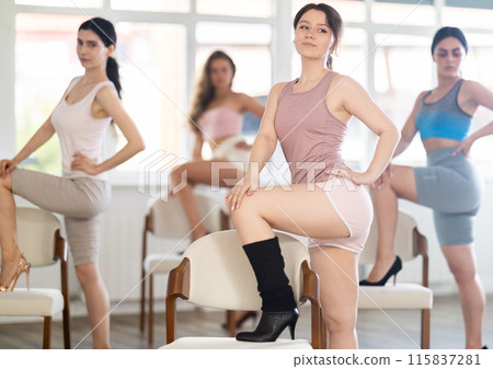 Beautiful graceful chair dance class practice at wall and window hall 115837281
