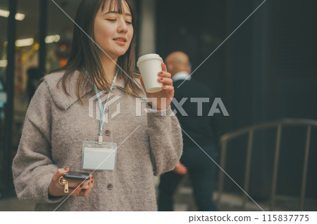A scene of a 20-something office lady going out during her lunch break A scene of a 20-something office lady going out during her lunch break 115837775