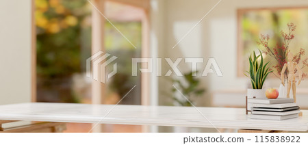 A white tabletop features decorative objects with a blurred background of a minimalist room. 115838922