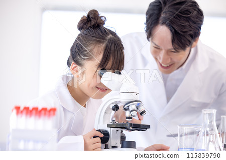 Elementary school girl and teacher studying science Elementary school girl and teacher studying science 115839790