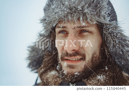 a bearded man in an earflap in winter 115840445