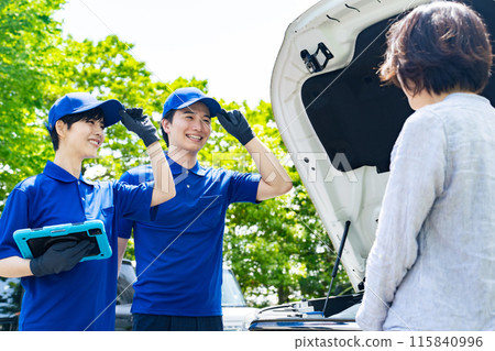 Workers rushing to repair a broken down car Workers rushing to repair a broken down car 115840996