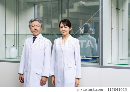 Middle-aged man and woman in white coat 115841013
