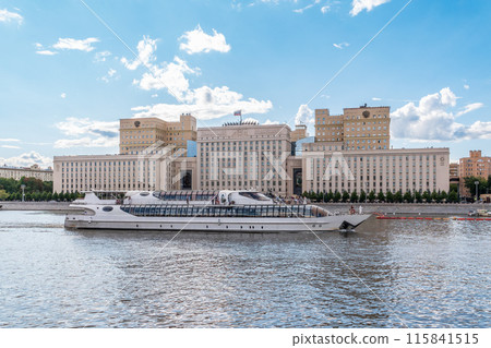 View of the Ministry of Defence of Russian Federation, and Moscow river embakment with cruise ships at sunset. 115841515