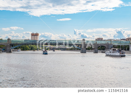 View of the Moscow river embakment, Pushkinsky bridge and cruise ships at sunset. 115841516