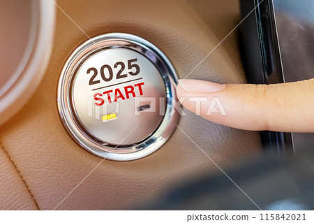 Finger press a car ignition button with 2025 START text inside  automobile. New Year New You, forecast, resolution, motivation, change, goal, vision, innovation and planning concept 115842021