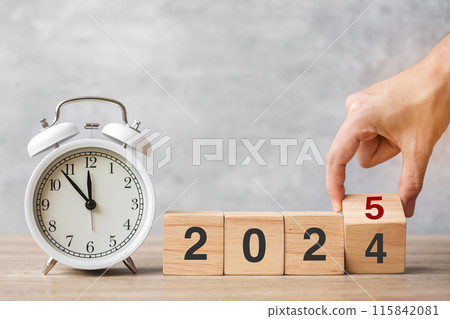 Happy New Year with vintage alarm clock and hand flipping 2024 change to 2025 block. Christmas, New Start, Resolution, countdown, Goals, Plan, Action and Motivation Concept Happy New Year with vintage alarm clock and hand flipping 2024 change to 2025 block. Christmas, New Start, Resolution, countdown, Goals, Plan, Action and Motivation Concept 115842081