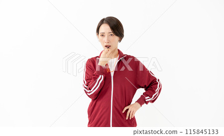 Woman in a jersey blowing a whistle Woman in a jersey blowing a whistle 115845133
