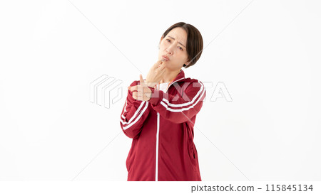 Woman in a jersey blowing a whistle 115845134