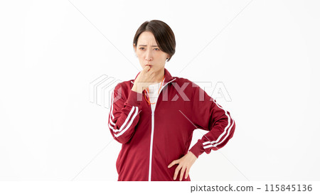 Woman in a jersey blowing a whistle 115845136