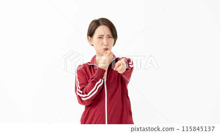 Woman in a jersey blowing a whistle 115845137