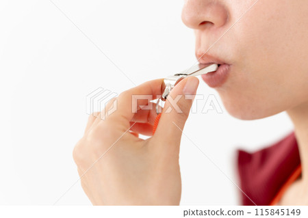 Woman in a jersey blowing a whistle, mouth 115845149