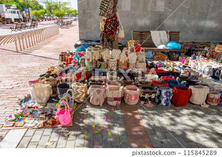 Colorful handmade bags at a vibrant street market. Santa Marta, Colombia Colorful handmade bags at a vibrant street market. Santa Marta, Colombia 115845289