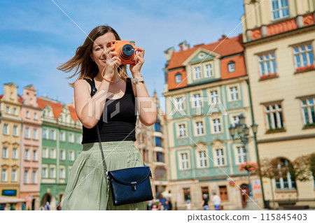 Young Woman Taking Photos in European City 115845403