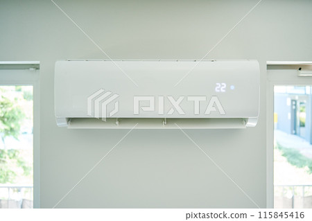 Air conditioner maintenance. Male technician repairing cooling system Air conditioner maintenance. Male technician repairing cooling system 115845416