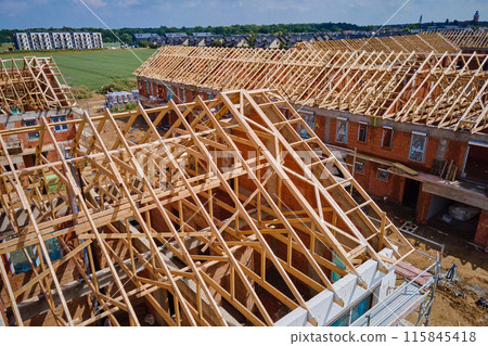 Aerial View of New Home Under Construction With Truss Roof Aerial View of New Home Under Construction With Truss Roof 115845418