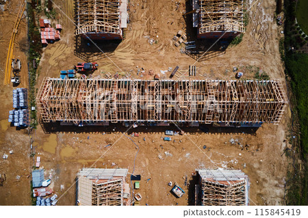 Aerial view of new house construction project in suburban area. Aerial view of new house construction project in suburban area. 115845419