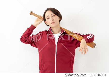 Woman in a jersey holding a bat 115846081