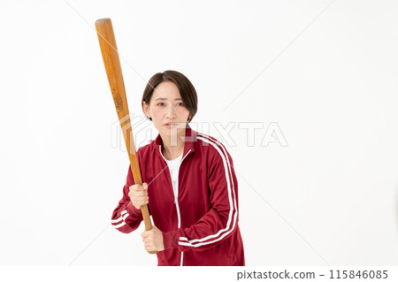 Woman in a jersey holding a bat 115846085