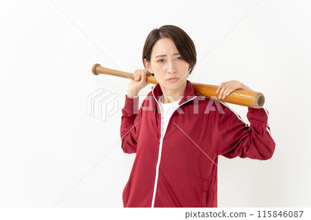 Woman in a jersey holding a bat 115846087