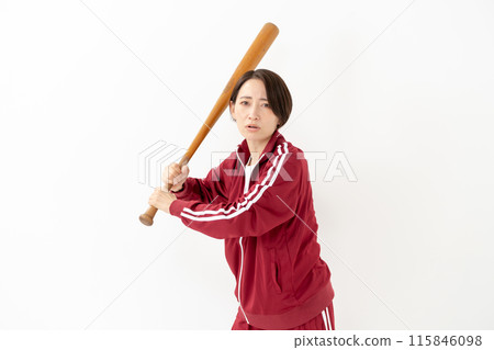 Woman in a jersey holding a bat 115846098