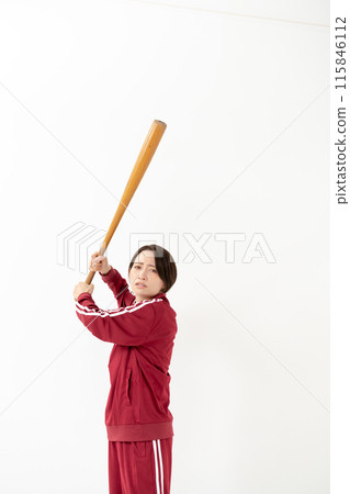 Woman in a jersey holding a bat 115846112