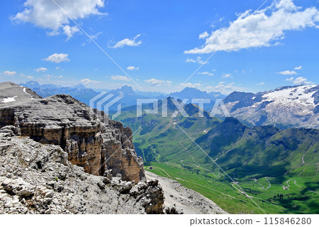 The cliffs of Sasso Pordoi and the peaks of Antelao, Permo and Tivetta from the Sasso Pordoi viewpoint 115846280