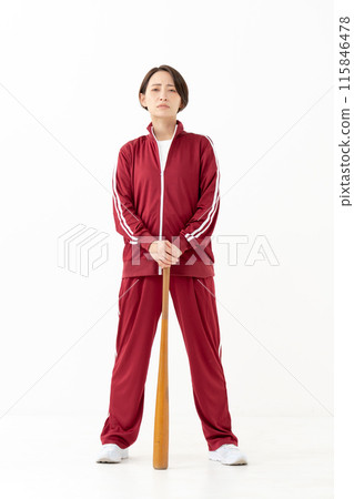 Woman in a jersey holding a bat, vertical 115846478