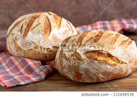 Round artisanal sourdough bread. 115846556