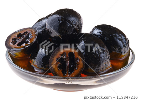 Saucer with homemade preserved walnuts isolated on white 115847216