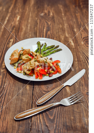 Chicken stew with vegetables and fried asparagus Chicken stew with vegetables and fried asparagus 115847237