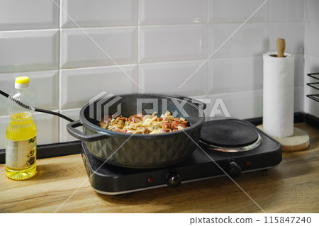 Making beef and vegetables ragout 115847240