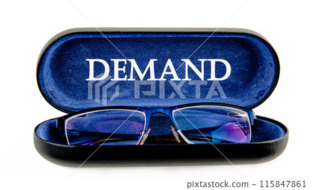 Business concept. A Word DEMAND symbol on the inside of the glasses case on a white background Business concept. A Word DEMAND symbol on the inside of the glasses case on a white background 115847861