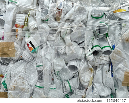 Compressed White Plastic Containers Wrapped for Recycling Compressed White Plastic Containers Wrapped for Recycling 115849437