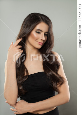 Brunette young adult model woman with long healthy hairstyle, fresh shiny clear skin  115850574