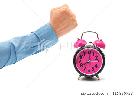Alarm clock and man hand in fist isolated on white. The concept of a bad dream 115850738