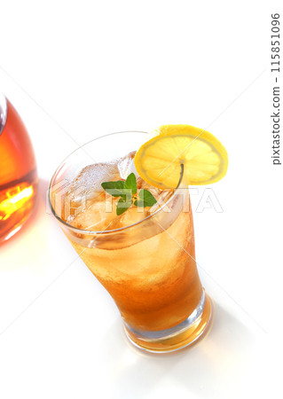 Ice lemon tea poured into a glass 115851096