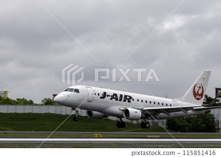 Passenger plane, airplane, J-AIR Embraer 170 landing at Osaka Airport and Itami Airport in the rain 115851416