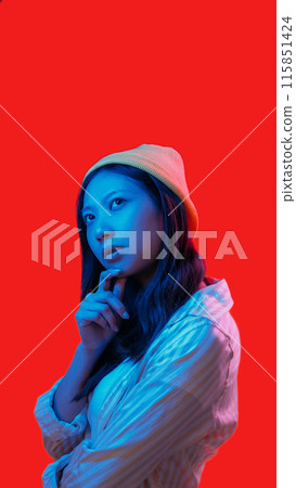 Thoughtful woman. Idea doubt. Pensive calm concentrated female hold finger head analyze look solution blue neon lights isolated on red empty space background. Thoughtful woman. Idea doubt. Pensive calm concentrated female hold finger head analyze look solution blue neon lights isolated on red empty space background. 115851424