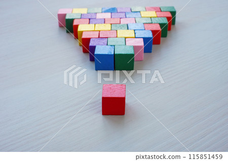 Inclusive Leadership abstract. A pyramid of colored cubes and the red one as the leader. 115851459