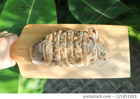 bread , whole wheat bread or sourdough bread or loaf of bread or cranberry and whole grain bread in the tray 115851883